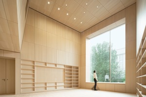  Das große Fenster in der Westfassade der mit Holz verkleideten Bibliothek öffnet den Blick auf den Vorplatz 